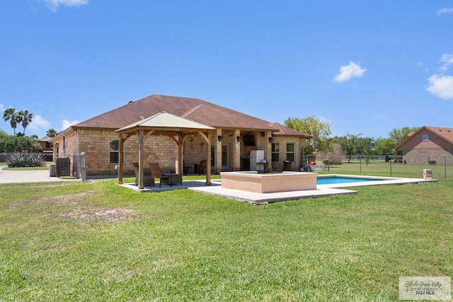 34164 Quail Dr, San Benito, TX 78586 - rear view of property with a gazebo and a patio area