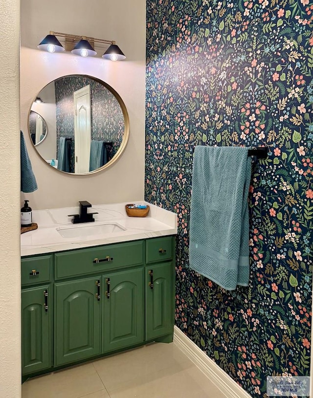 bathroom featuring tile patterned flooring, vanity, and baseboards