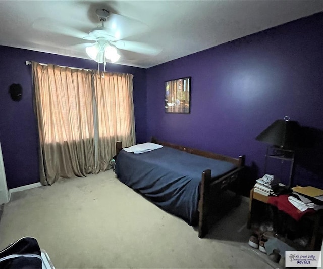 bedroom with ceiling fan and carpet floors