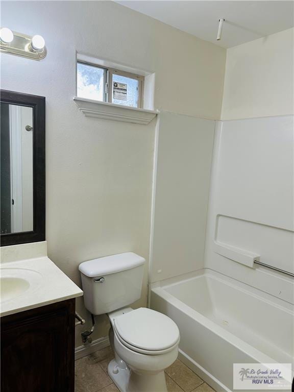 full bathroom with tile patterned floors, washtub / shower combination, vanity, and toilet