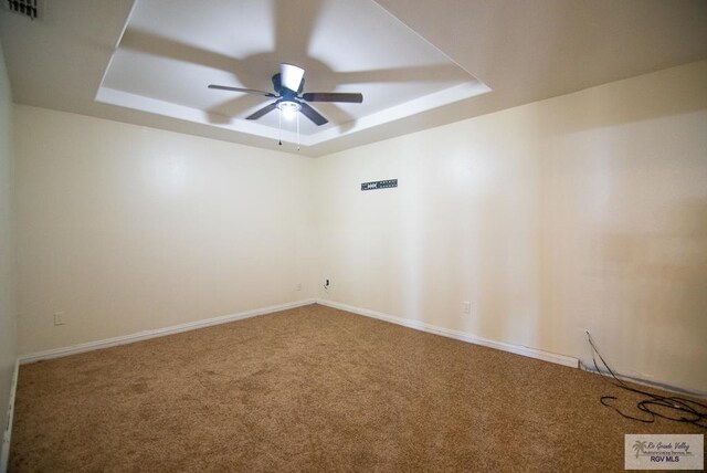 3630 Sun Dr, Harlingen, TX 78552 - carpeted empty room with a raised ceiling, a ceiling fan, and baseboards