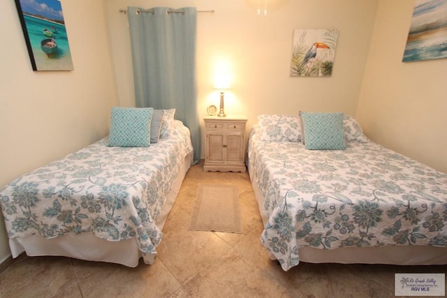 bedroom featuring light tile patterned floors