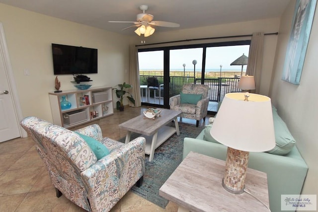 tiled living room with ceiling fan