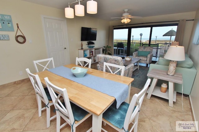 dining space featuring ceiling fan