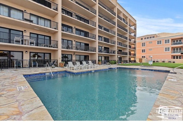 view of pool featuring a patio area