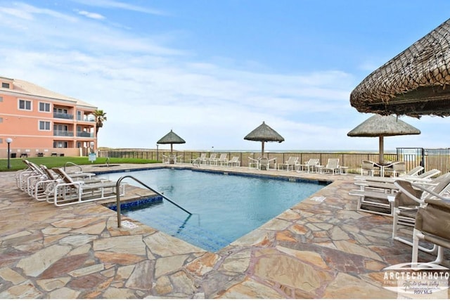 view of swimming pool featuring a patio area