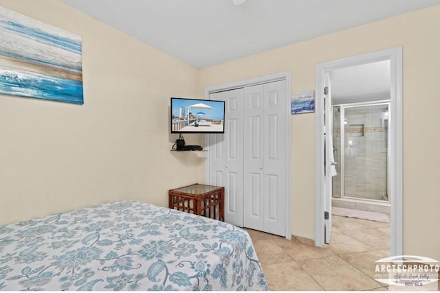 bedroom with ensuite bathroom, a closet, and light tile patterned floors