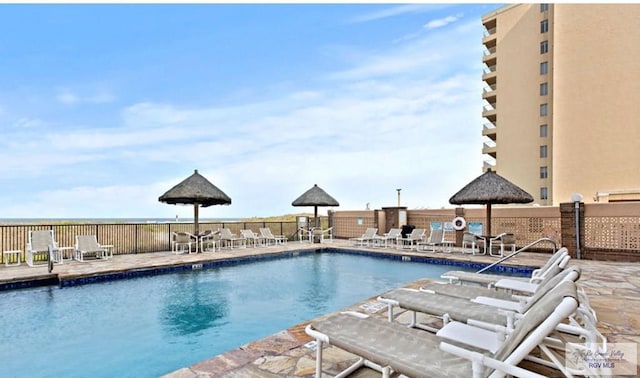 view of swimming pool featuring a patio area