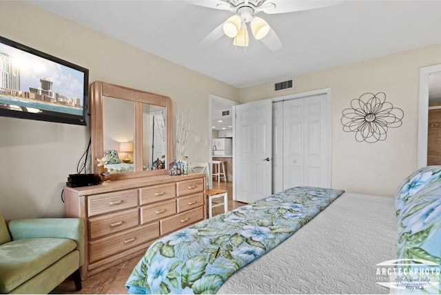 carpeted bedroom featuring a closet and ceiling fan