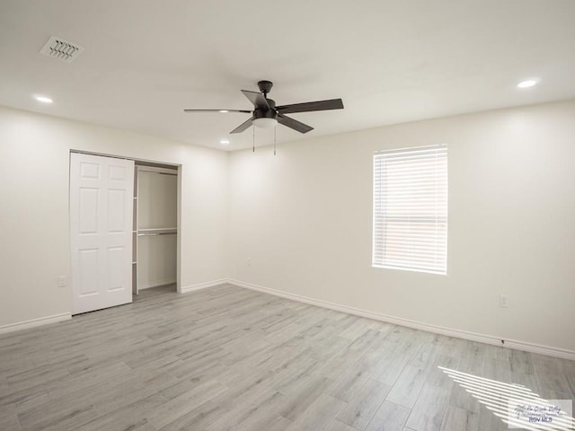 unfurnished bedroom with a closet, ceiling fan, and light hardwood / wood-style flooring