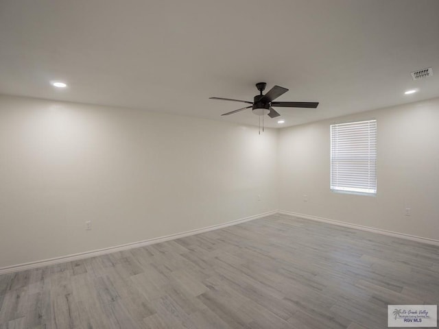 unfurnished room featuring ceiling fan and light wood-type flooring