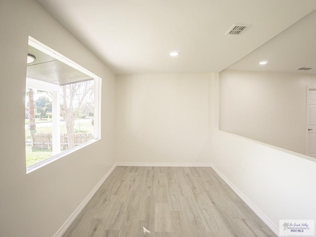 unfurnished room with light hardwood / wood-style flooring