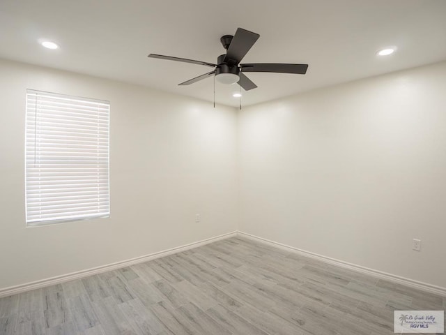 unfurnished room with ceiling fan and light hardwood / wood-style floors