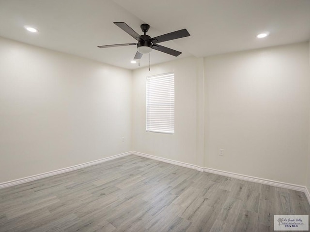 empty room with ceiling fan and light wood-type flooring