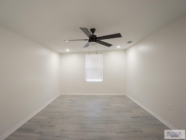 spare room with ceiling fan and light hardwood / wood-style floors