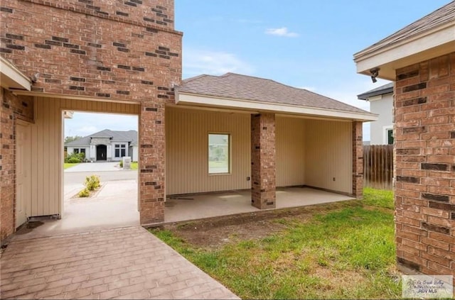 doorway to property with a patio area