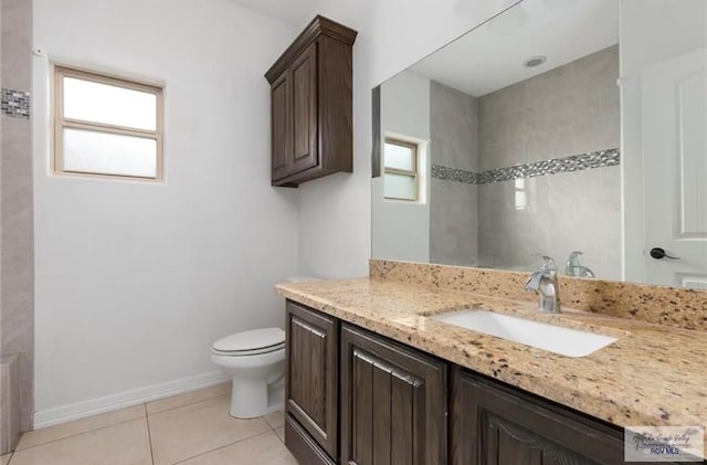 bathroom featuring tile patterned flooring, vanity, and toilet