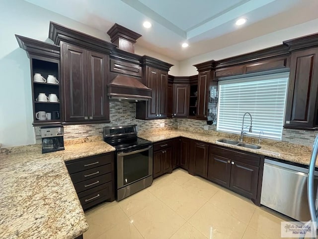 kitchen featuring open shelves, stainless steel appliances, a sink, dark brown cabinetry, and custom range hood