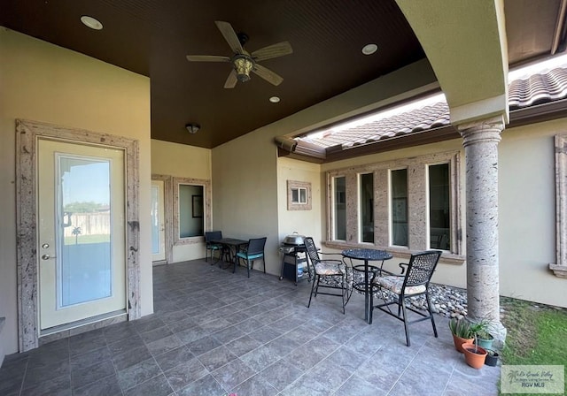 view of patio / terrace featuring outdoor dining area and a ceiling fan