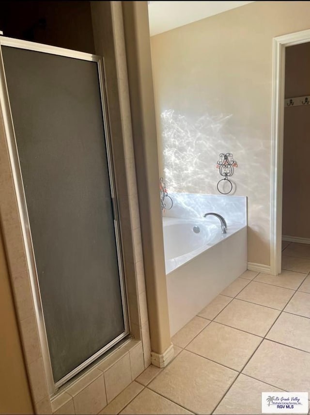 bathroom featuring separate shower and tub and tile patterned floors