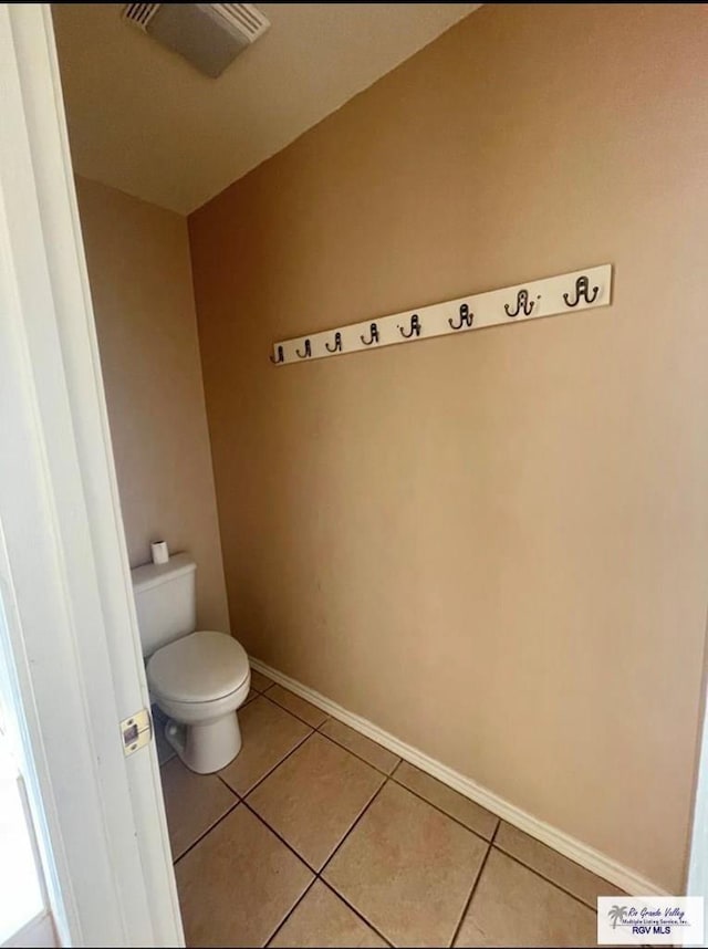 bathroom with tile patterned floors and toilet