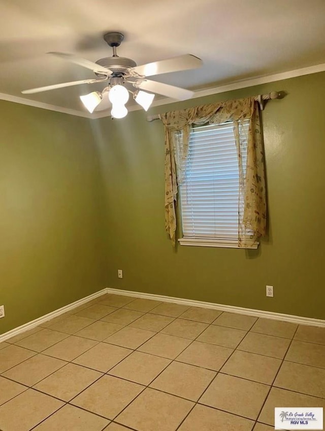 unfurnished room with ceiling fan, crown molding, and light tile patterned floors