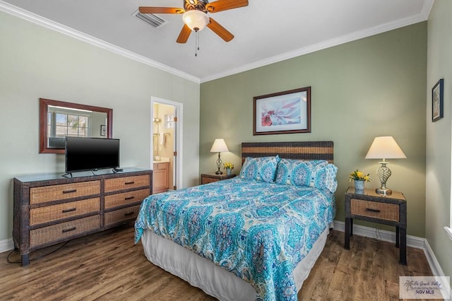 106 Atol St Unit 7, South Padre Island, TX 78597 - bedroom with wood finished floors, crown molding, baseboards, and connected bathroom