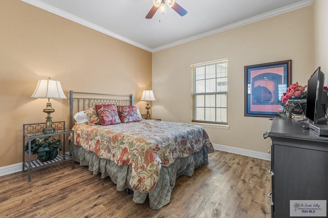 106 Atol St Unit 7, South Padre Island, TX 78597 - bedroom with baseboards, crown molding, wood finished floors, and ceiling fan
