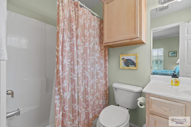 106 Atol St Unit 7, South Padre Island, TX 78597 - bathroom featuring toilet, vanity, and shower / tub combo