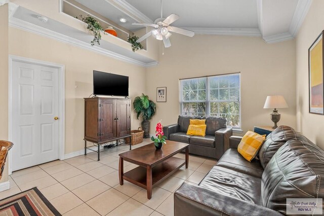 106 Atol St Unit 7, South Padre Island, TX 78597 - living area with light tile patterned floors, ceiling fan, ornamental molding, high vaulted ceiling, and baseboards