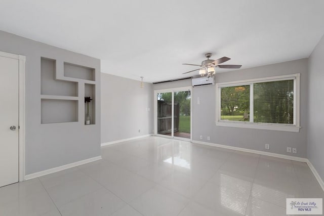 tiled empty room with a wall mounted air conditioner and ceiling fan