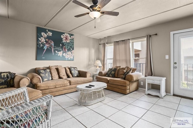 living room featuring tile patterned flooring and ceiling fan