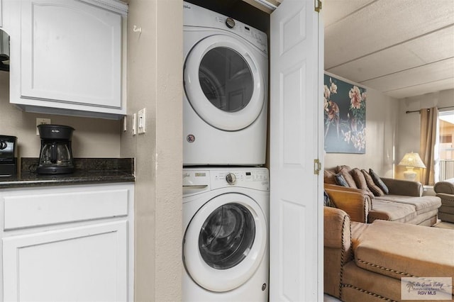 washroom with stacked washer / dryer