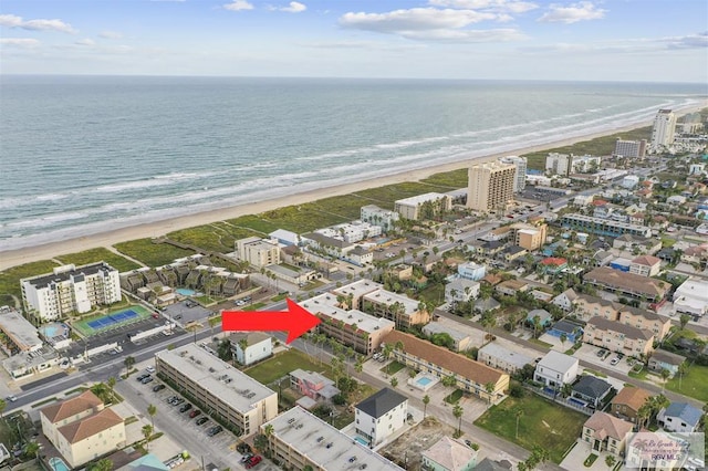 bird's eye view featuring a beach view and a water view