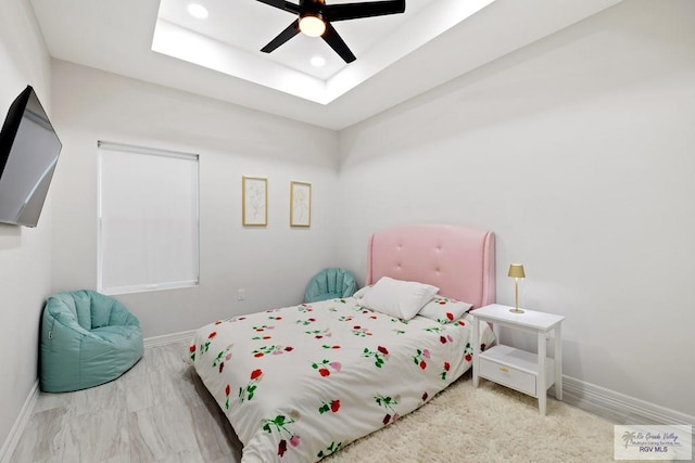 bedroom with a skylight and ceiling fan