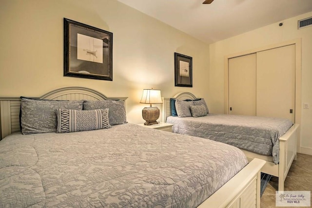 bedroom featuring ceiling fan and a closet