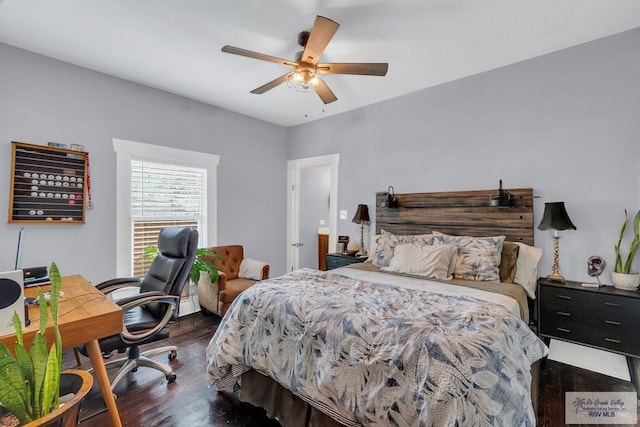 bedroom featuring ceiling fan and dark hardwood / wood-style floors