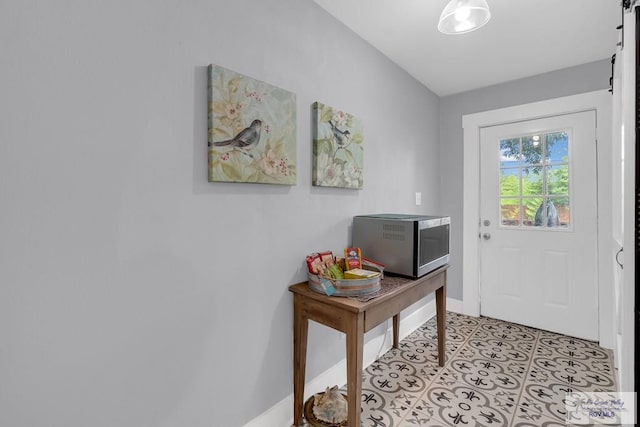 entryway featuring light tile patterned floors