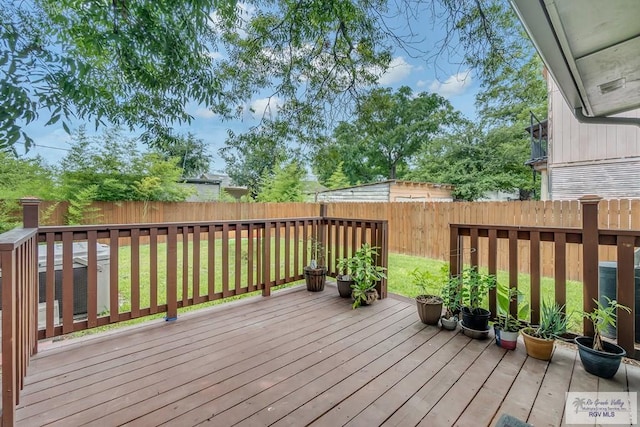 wooden deck with a yard