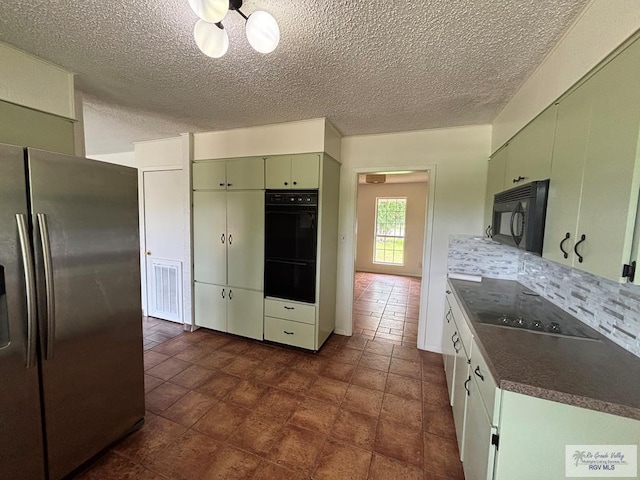 200 E Resaca Dr, Los Fresnos, TX 78566 - kitchen with black appliances, a textured ceiling, dark countertops, backsplash, and green cabinetry