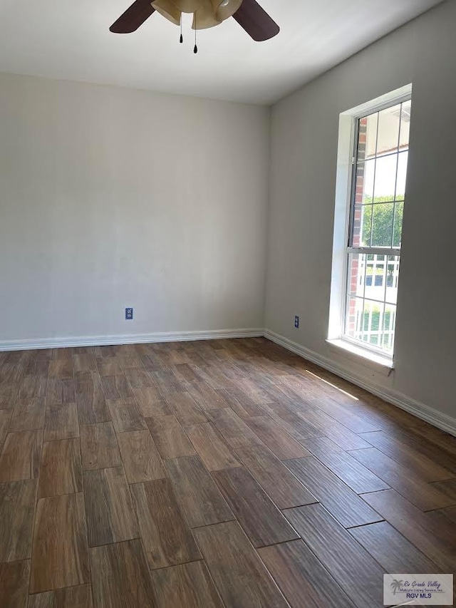 200 E Resaca Dr, Los Fresnos, TX 78566 - spare room featuring a ceiling fan and dark wood-style flooring