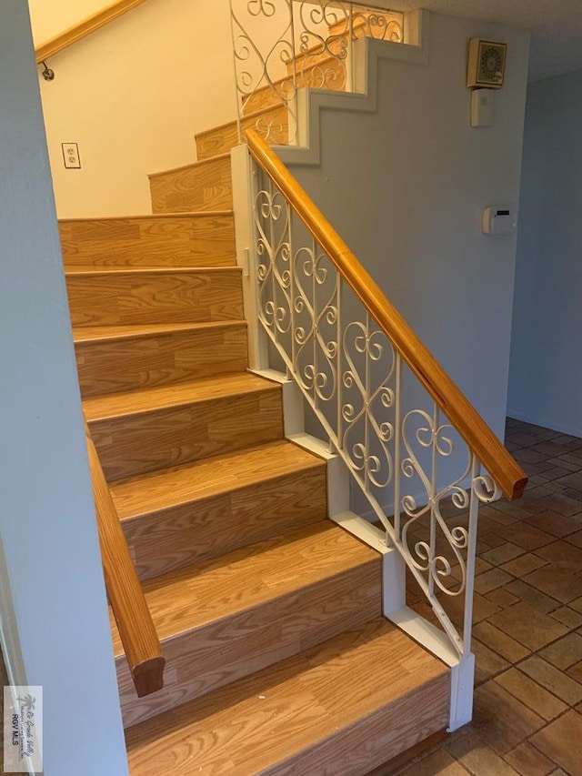 200 E Resaca Dr, Los Fresnos, TX 78566 - staircase featuring brick patterned flooring