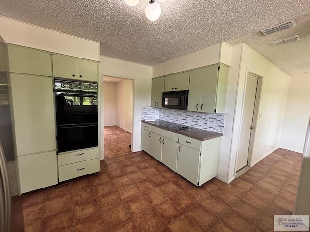 200 E Resaca Dr, Los Fresnos, TX 78566 - kitchen with black appliances, green cabinetry, dark countertops, a textured ceiling, and decorative backsplash