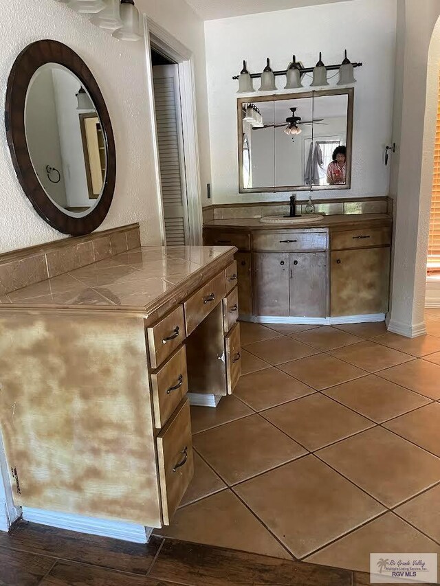 bathroom featuring tile patterned floors and vanity