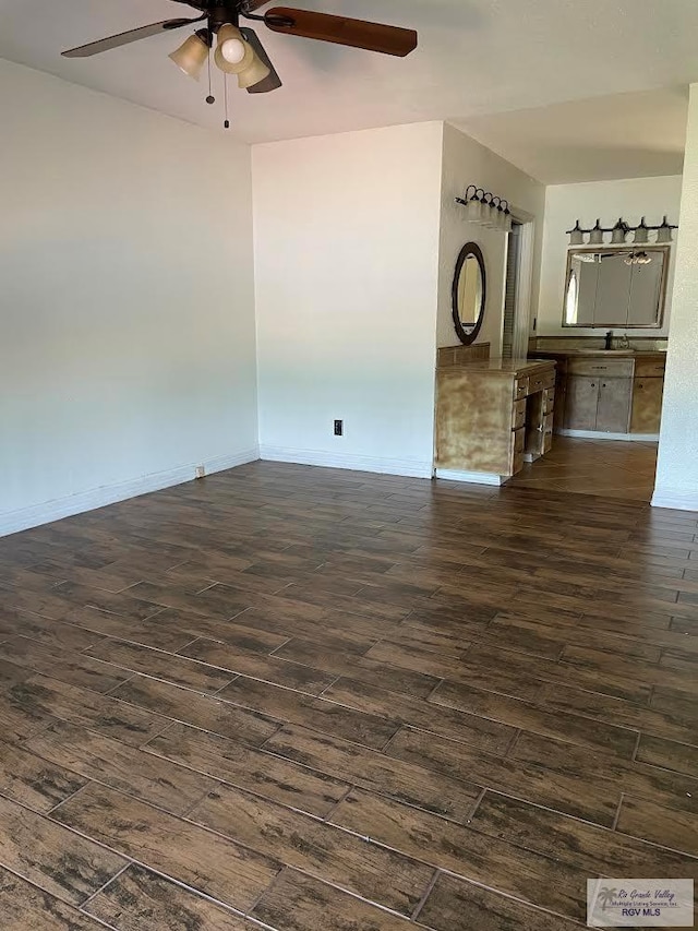 200 E Resaca Dr, Los Fresnos, TX 78566 - unfurnished living room featuring dark wood-type flooring and a ceiling fan