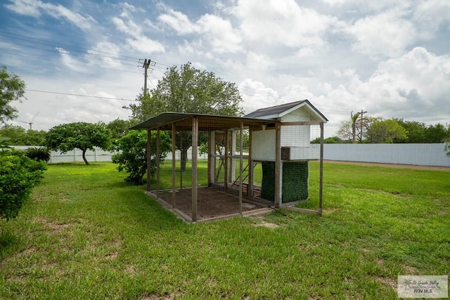 exterior space with a lawn and an outbuilding