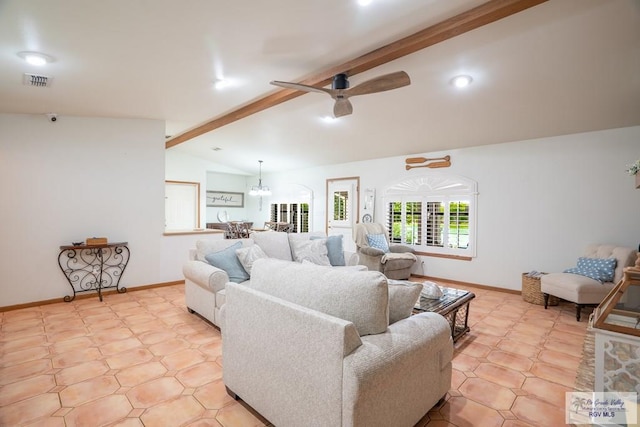 living room featuring lofted ceiling with beams and ceiling fan with notable chandelier