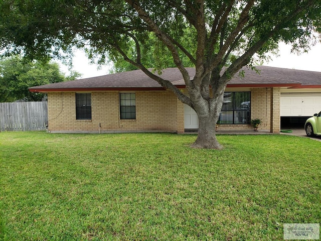 exterior space featuring a garage and a front lawn