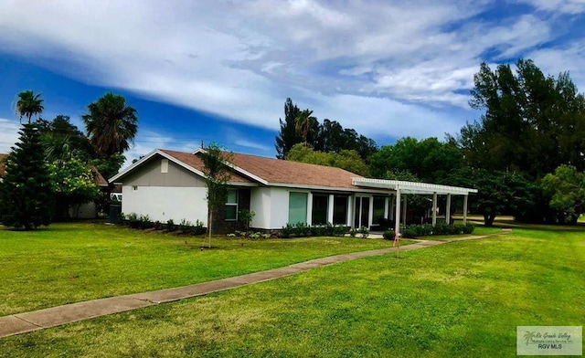 single story home with a front yard and a pergola