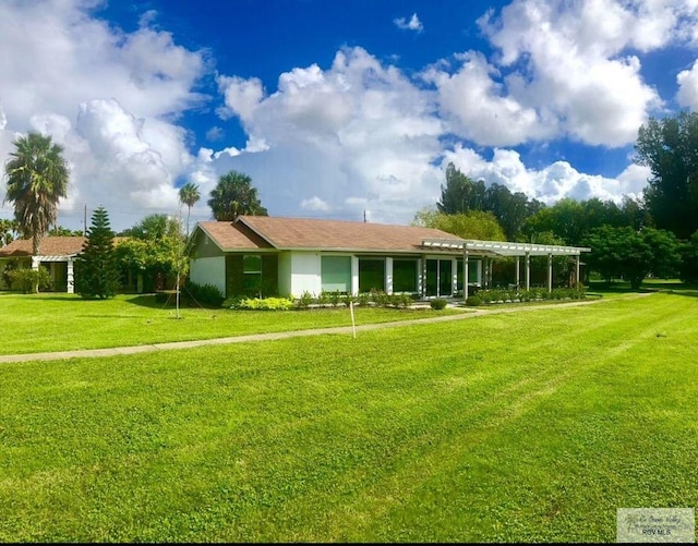 single story home featuring a front yard